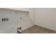 Tiled laundry room with utility connections and plenty of space for folding at 4067 S White Dr, Chandler, AZ 85249