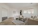 Inviting living room area with neutral colors, modern decor, and an open view to the kitchen at 4067 S White Dr, Chandler, AZ 85249