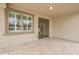 A covered patio features tiled floors, large windows, and a sliding glass door entry at 4067 S White Dr, Chandler, AZ 85249
