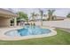 A beautifully designed pool and spa with a built-in gazebo and lush landscaping enhance the outdoor living space at 4067 S White Dr, Chandler, AZ 85249