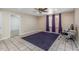 Versatile bedroom space with tile flooring, a ceiling fan, and natural light at 4114 E Muirwood Dr, Phoenix, AZ 85048