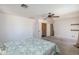 Bedroom with carpeted flooring, a ceiling fan, and neutral walls at 4114 E Muirwood Dr, Phoenix, AZ 85048