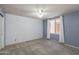 Spacious bedroom features plush carpeting, a window and a large closet at 4114 E Muirwood Dr, Phoenix, AZ 85048