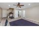 Open room with fitness equipment, neutral walls, and staircase at 4114 E Muirwood Dr, Phoenix, AZ 85048