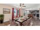 Elegant dining room with pool views, perfect for entertaining at 4114 E Muirwood Dr, Phoenix, AZ 85048