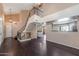 Spacious living room featuring high ceilings, modern staircase, and open-concept layout at 4114 E Muirwood Dr, Phoenix, AZ 85048