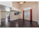Bright living room featuring wood floors, high ceilings, and large windows at 4114 E Muirwood Dr, Phoenix, AZ 85048