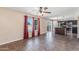 A combined living space featuring tile flooring, an open floor plan, and a view into the kitchen at 4114 E Muirwood Dr, Phoenix, AZ 85048
