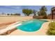 Inviting pool with diving board, surrounded by a well-maintained patio and mature landscaping at 4114 E Muirwood Dr, Phoenix, AZ 85048