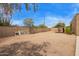 Spacious dirt backyard with potential for customization and development at 4922 W Fallen Leaf Ln, Glendale, AZ 85310