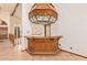 Home bar featuring custom wood work, stained glass, and shelving at 4922 W Fallen Leaf Ln, Glendale, AZ 85310