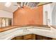 The house has a bar, tile counters, sink, and wooden accents at 4922 W Fallen Leaf Ln, Glendale, AZ 85310