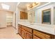 Bathroom with a vanity, skylight, and a walk in closet at 4922 W Fallen Leaf Ln, Glendale, AZ 85310