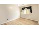 Bedroom with wood floor and sheer black curtains at 4922 W Fallen Leaf Ln, Glendale, AZ 85310