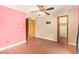 Bedroom with a hardwood floors, ceiling fan, and a closet at 4922 W Fallen Leaf Ln, Glendale, AZ 85310