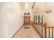Inviting entryway featuring tile floors, vaulted ceilings, and wood doors at 4922 W Fallen Leaf Ln, Glendale, AZ 85310