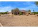 Well-maintained exterior with a three-car garage and desert landscaping for low maintenance at 4922 W Fallen Leaf Ln, Glendale, AZ 85310