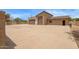A large detached garage/workshop with multiple bays and a spacious concrete apron at 4922 W Fallen Leaf Ln, Glendale, AZ 85310
