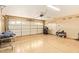 Spacious garage with epoxy floor and garage door at 4922 W Fallen Leaf Ln, Glendale, AZ 85310