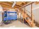 Garage area featuring a mechanic's tool chest, a staircase, and exposed wooden beams at 4922 W Fallen Leaf Ln, Glendale, AZ 85310