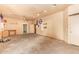 Spacious garage interior with unfinished walls, ceiling fan and concrete flooring at 4922 W Fallen Leaf Ln, Glendale, AZ 85310
