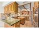 Beautiful kitchen with green marble countertops, custom wood cabinetry, and stainless steel appliances at 4922 W Fallen Leaf Ln, Glendale, AZ 85310