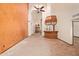 Open living room with fireplace, bar, and tile flooring at 4922 W Fallen Leaf Ln, Glendale, AZ 85310