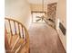 Open-concept living room featuring a stone fireplace and large windows at 4922 W Fallen Leaf Ln, Glendale, AZ 85310