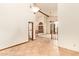 Large living room with views of the front entryway and vaulted ceilings at 4922 W Fallen Leaf Ln, Glendale, AZ 85310