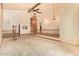 Spacious living room with high ceilings, a ceiling fan, and decorative wood accents at 4922 W Fallen Leaf Ln, Glendale, AZ 85310