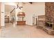 Spacious open living room features a fireplace and a wet bar at 4922 W Fallen Leaf Ln, Glendale, AZ 85310