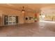 Large covered patio with stone flooring and ceiling fans at 4922 W Fallen Leaf Ln, Glendale, AZ 85310