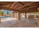 Covered patio with access to pool area and large stone flooring at 4922 W Fallen Leaf Ln, Glendale, AZ 85310