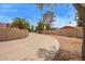 Image of street view with desert landscaping and mature trees surrounding stucco wall at 4922 W Fallen Leaf Ln, Glendale, AZ 85310