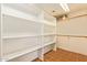 Walk-in closet with custom shelving at 4922 W Fallen Leaf Ln, Glendale, AZ 85310