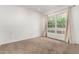 Bright bedroom with neutral carpet and a large window offering plenty of natural light at 5200 S Lakeshore Dr # 206, Tempe, AZ 85283
