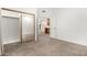 Bedroom with carpet, sliding mirror closet, and view to other rooms at 5200 S Lakeshore Dr # 206, Tempe, AZ 85283