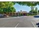Community clubhouse is surrounded by a well-maintained parking lot at 5200 S Lakeshore Dr # 206, Tempe, AZ 85283