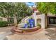 An ornate fountain with blue tiles and lion head accents is surrounded by flowering trees at 5200 S Lakeshore Dr # 206, Tempe, AZ 85283