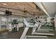 Well-equipped gym featuring treadmills, elliptical machines, and multiple ceiling fans at 5200 S Lakeshore Dr # 206, Tempe, AZ 85283