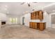 Open-concept living room with wet bar, fireplace, and bright natural light at 5200 S Lakeshore Dr # 206, Tempe, AZ 85283