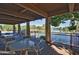 Covered patio area offers seating and views of the community pool and waterfront at 5200 S Lakeshore Dr # 206, Tempe, AZ 85283