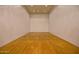 Clean indoor racquetball court with hardwood flooring and bright lighting at 5200 S Lakeshore Dr # 206, Tempe, AZ 85283