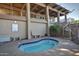 Relaxing outdoor spa with blue tiled pool and convenient seating under a covered patio at 5200 S Lakeshore Dr # 206, Tempe, AZ 85283