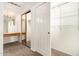 Walk-in closet with built-in vanity and ample shelving for organization at 5200 S Lakeshore Dr # 206, Tempe, AZ 85283