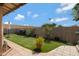 Well-maintained backyard with artificial grass, tile patio, and a relaxing outdoor space at 5231 E Tamblo Dr, Phoenix, AZ 85044