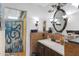 Charming bathroom with unique tilework, vanity, and octopus shower curtain, offering a quirky aesthetic at 5231 E Tamblo Dr, Phoenix, AZ 85044