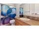Bathroom featuring vanity with solid surface counters and decorative blue shower curtain at 5231 E Tamblo Dr, Phoenix, AZ 85044