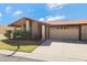 Inviting single-story house featuring a two-car garage, landscaped yard, and a tile roof at 5231 E Tamblo Dr, Phoenix, AZ 85044