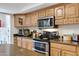 Well-equipped kitchen featuring modern appliances, ample cabinet space, and countertops at 5231 E Tamblo Dr, Phoenix, AZ 85044